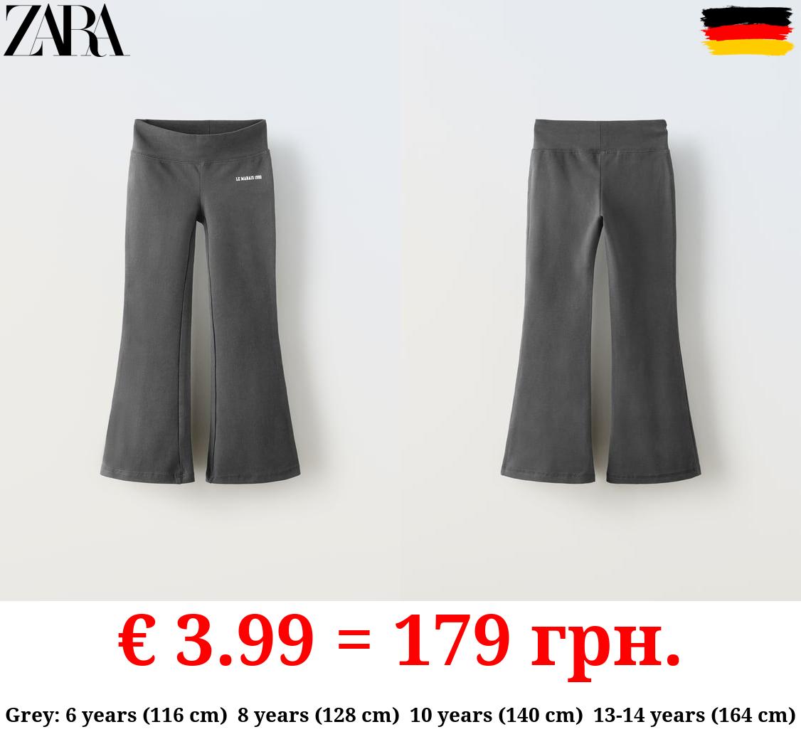 FLARED LEGGINGS WITH SLOGAN