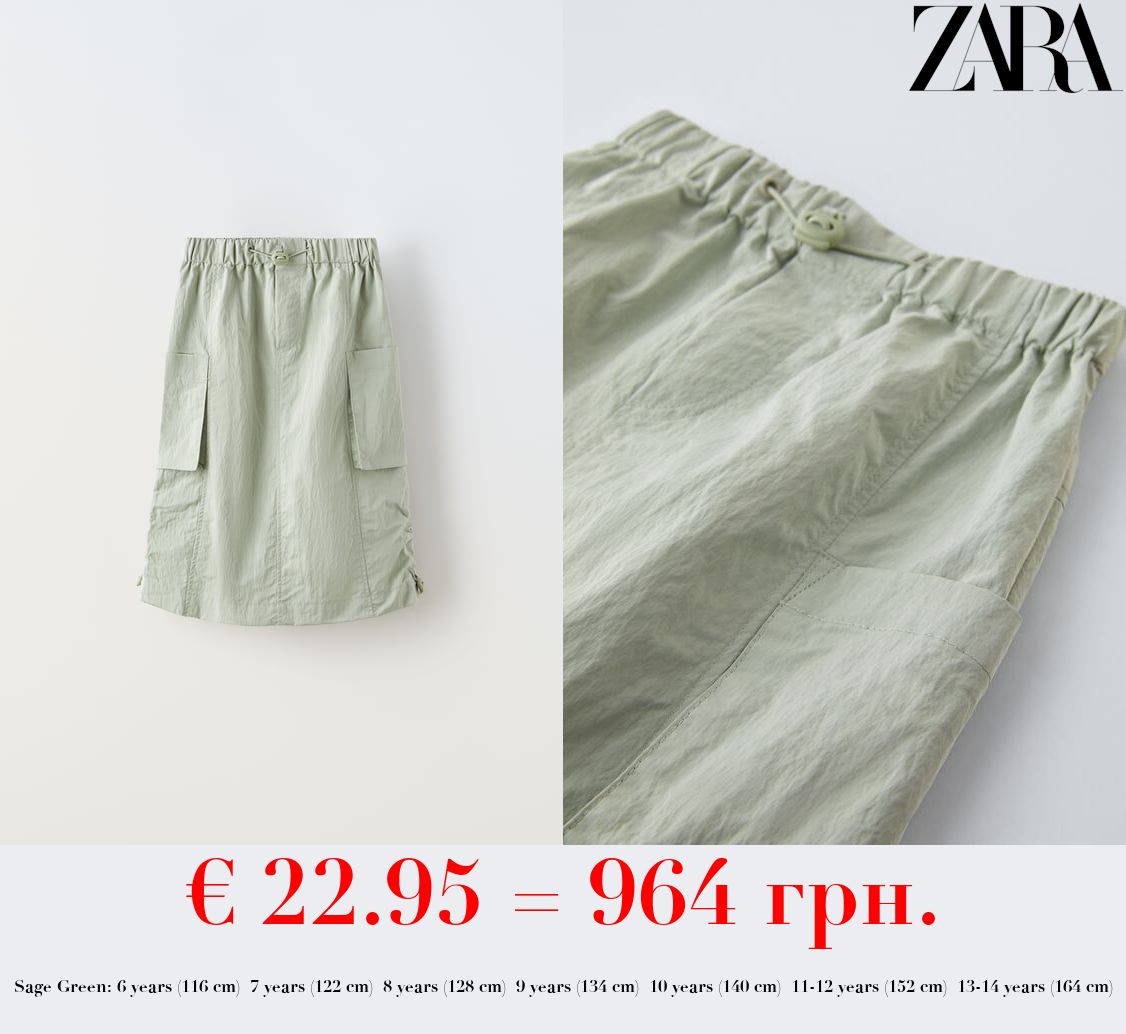 TECHNICAL SKIRT WITH POCKETS AND STOPPER