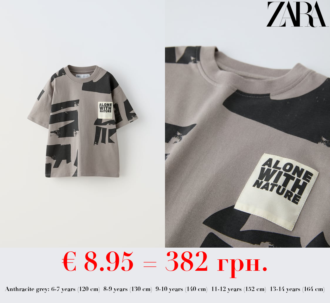 T-SHIRT WITH TAG APPLIQUÉ