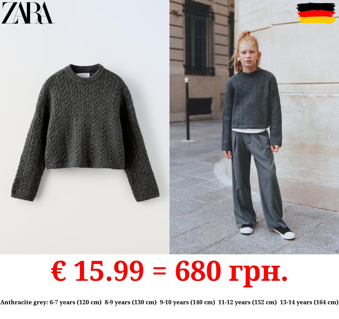 CABLE-KNIT SWEATER