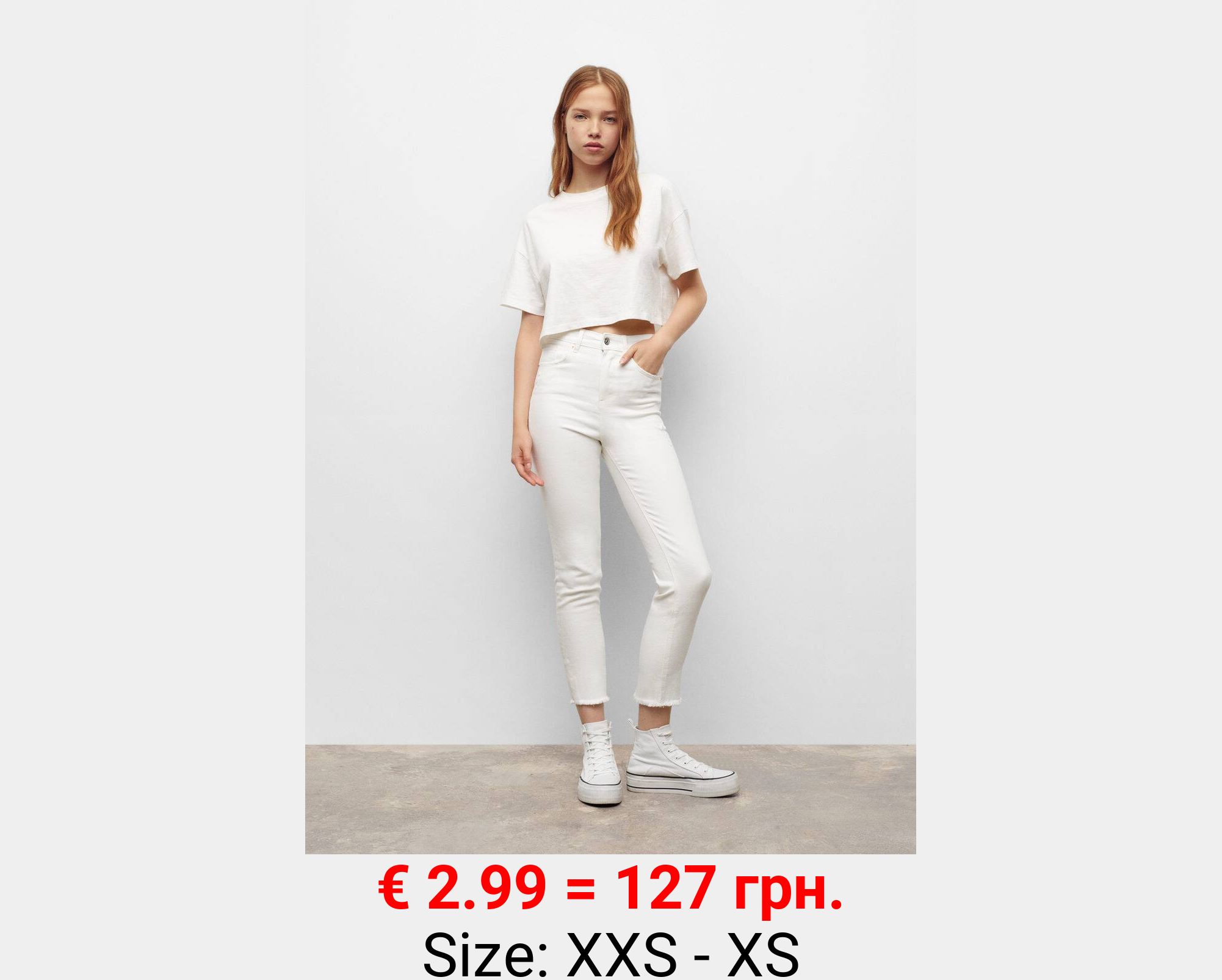 Jeans slim bajo deshilachado