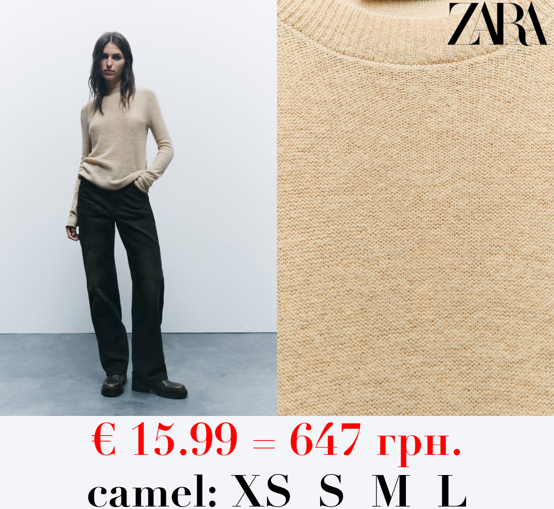 KNIT SWEATER WITH ROLLING TRIMS