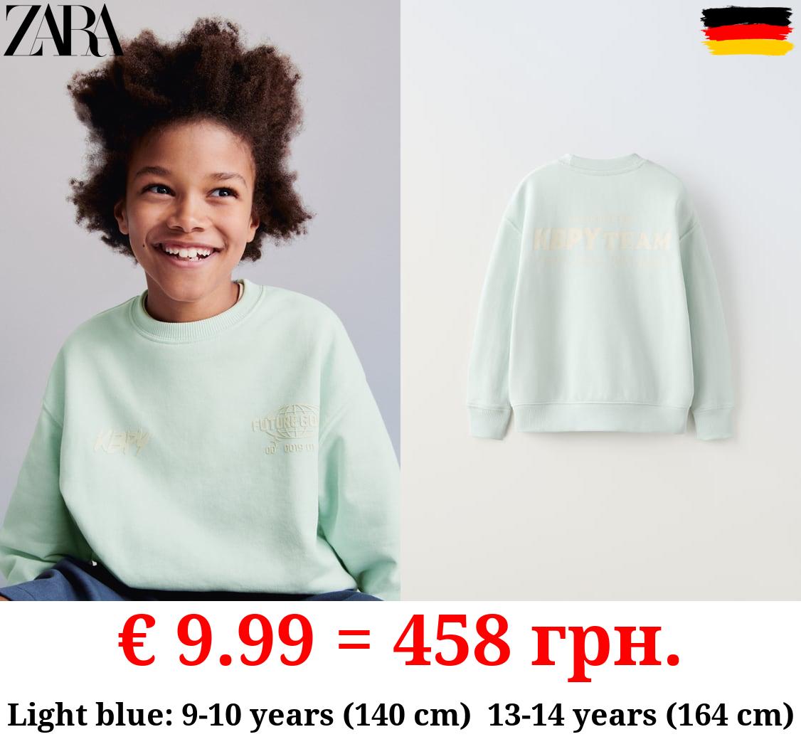 SWEATSHIRT WITH RAISED SLOGAN