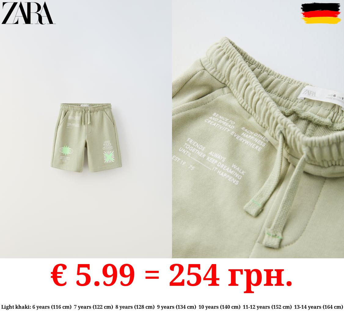 PLUSH BERMUDA SHORTS WITH NEON SLOGANS