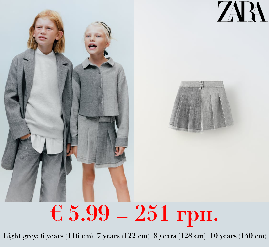 ASYMMETRIC SKIRT WITH FRAYED HEM