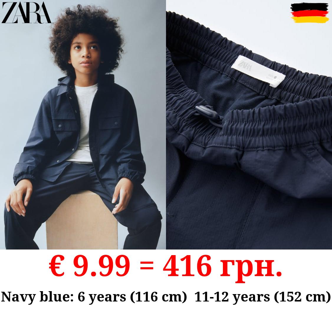 LINED NYLON TROUSERS