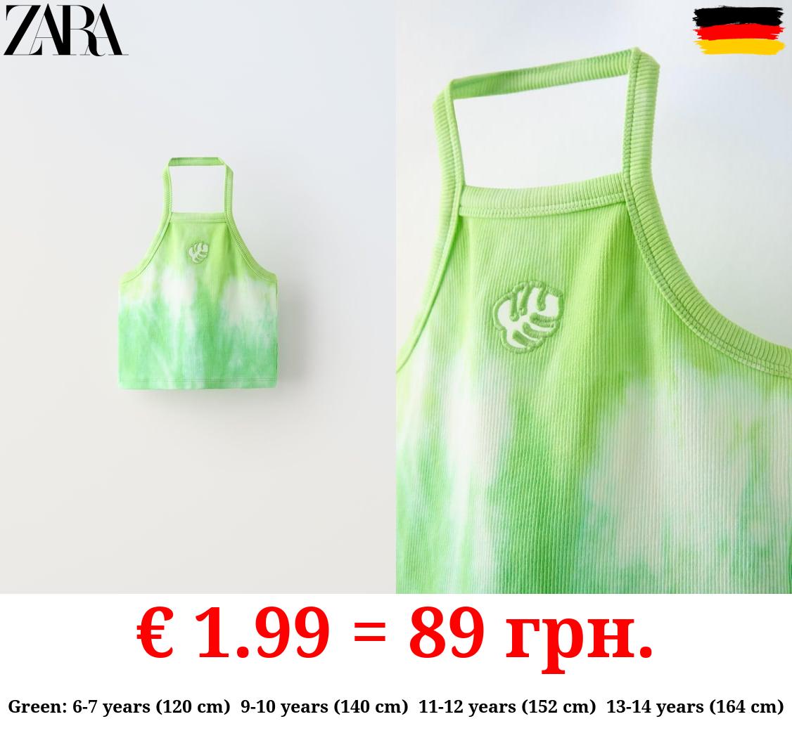 TIE-DYE TOP WITH CUT-OUT DETAIL