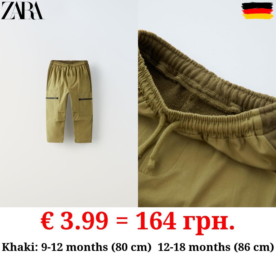 TROUSERS WITH CONTRAST ZIPS