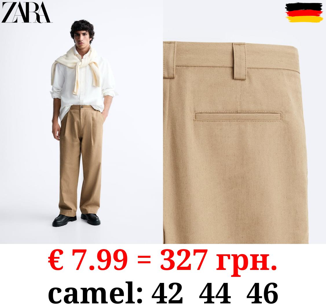 PLEATED TROUSERS
