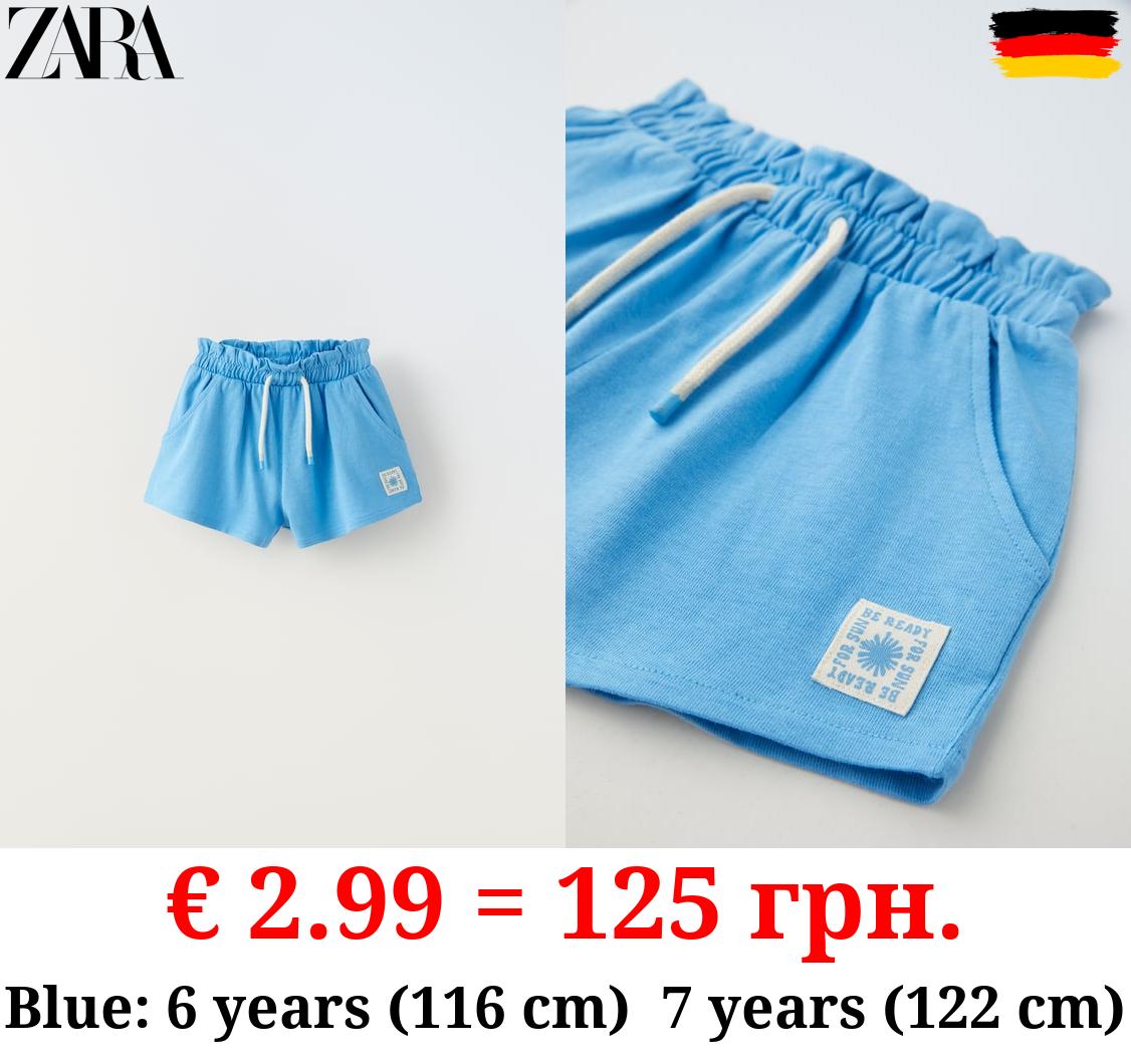 PLUSH BERMUDA SHORTS WITH LABEL DETAIL