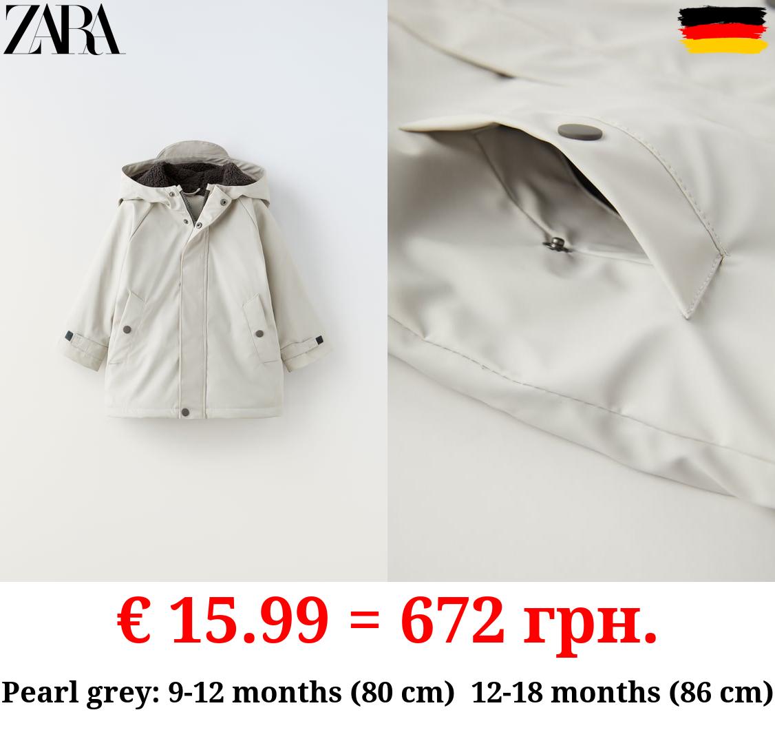 RUBBERISED RAINCOAT WITH FAUX SHEARLING