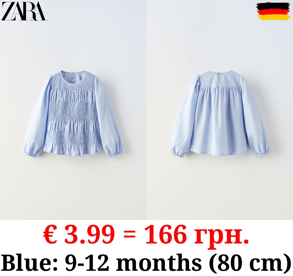 TEXTURED BLOUSE WITH ELASTICATED TRIMS