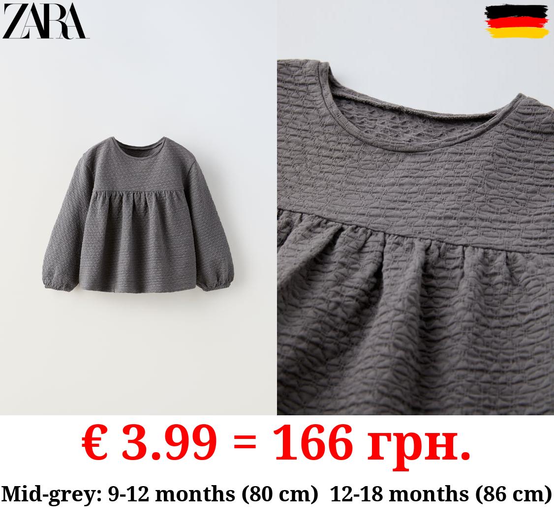 TEXTURED OVERSIZE BLOUSE