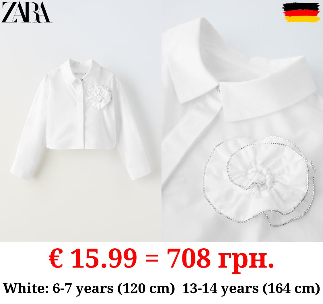 SHIRT WITH SHIMMERY FLOWER DETAIL