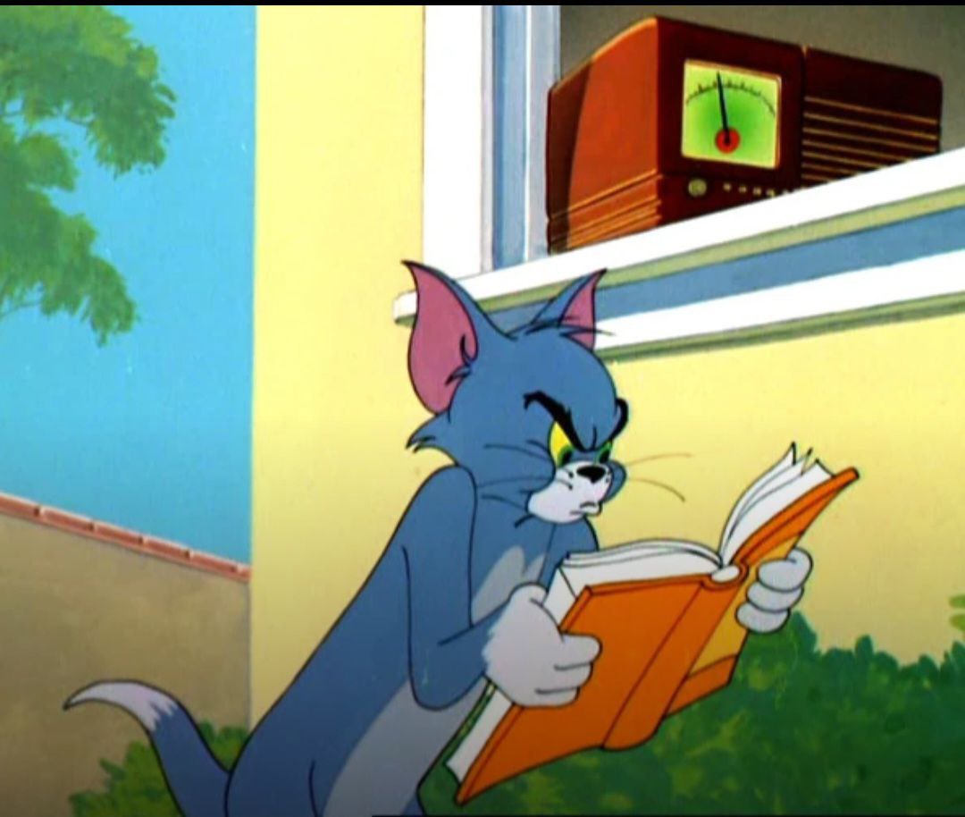 Tom reads a book