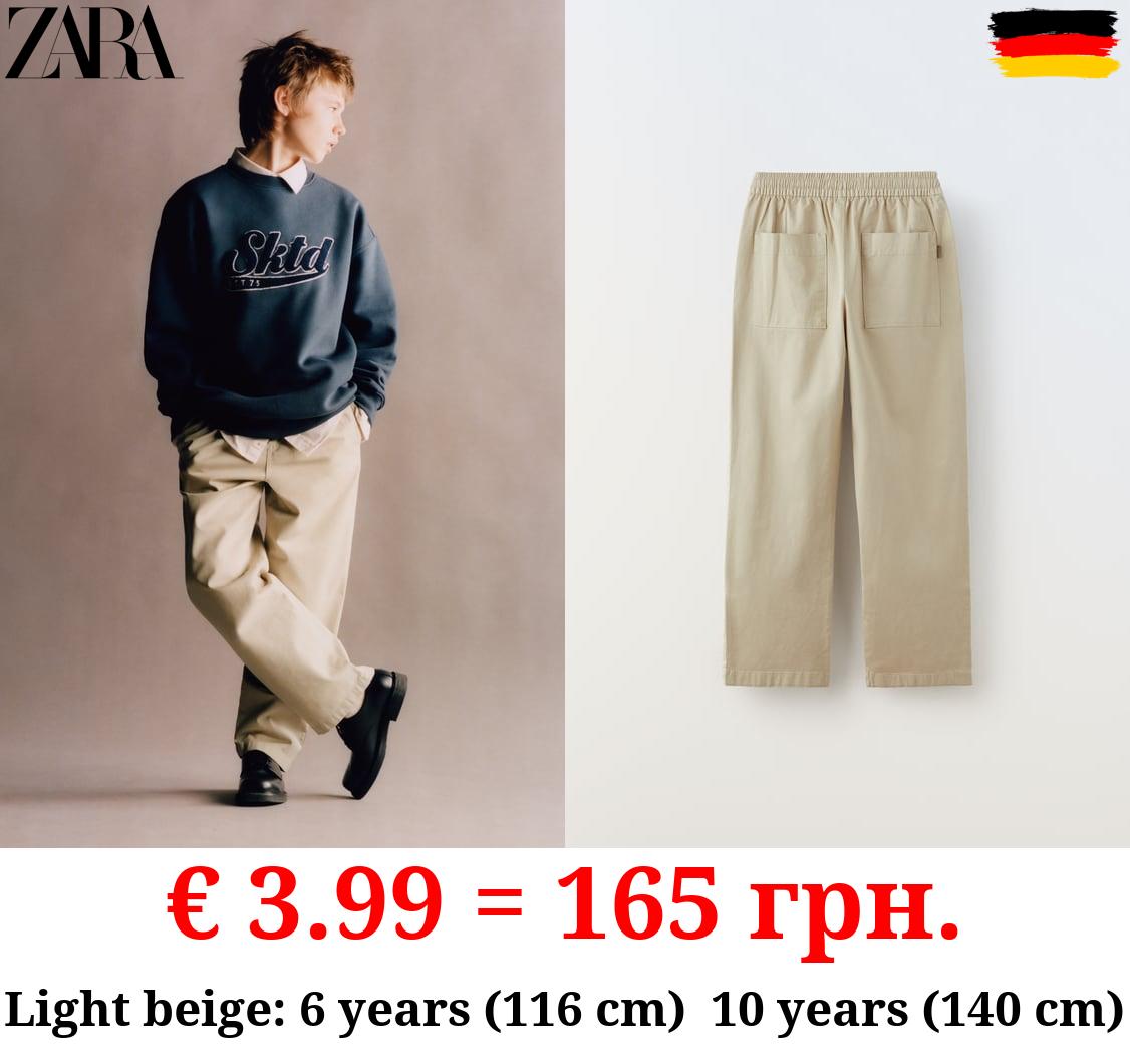 CHINO TROUSERS
