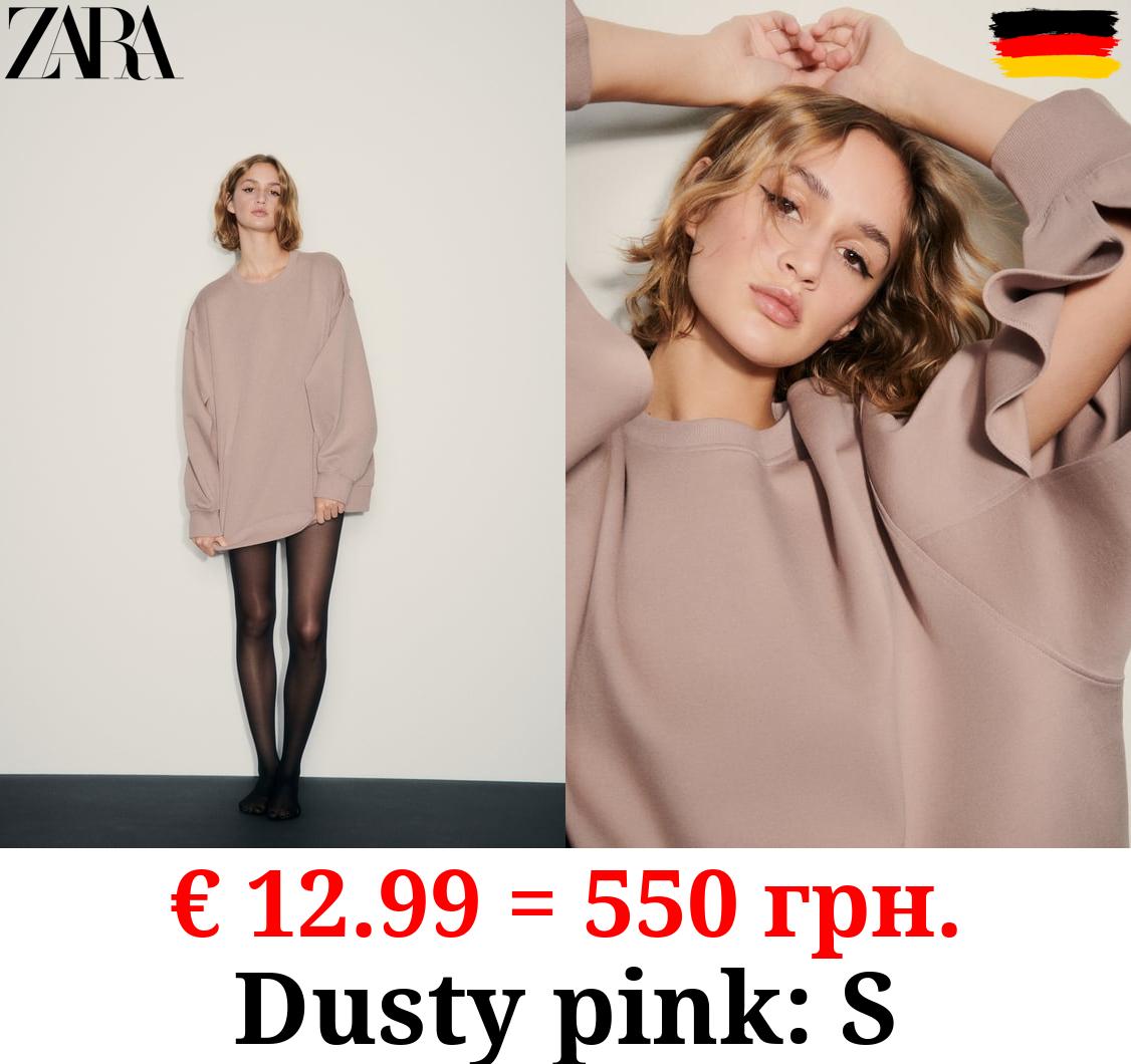 OVERSIZE INTERLOCK SWEATSHIRT WITH OPENING DETAIL