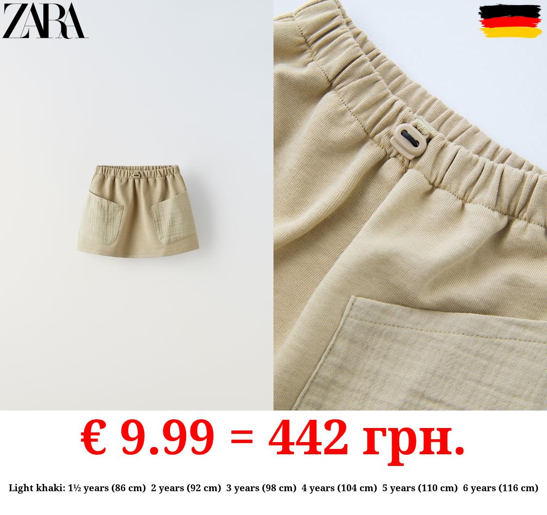 CONTRAST SKIRT WITH POCKETS