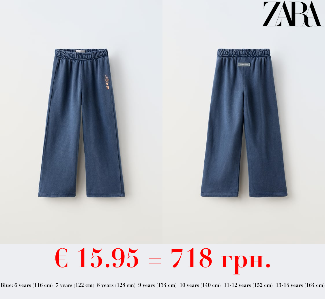 FADED TROUSERS WITH SLOGAN