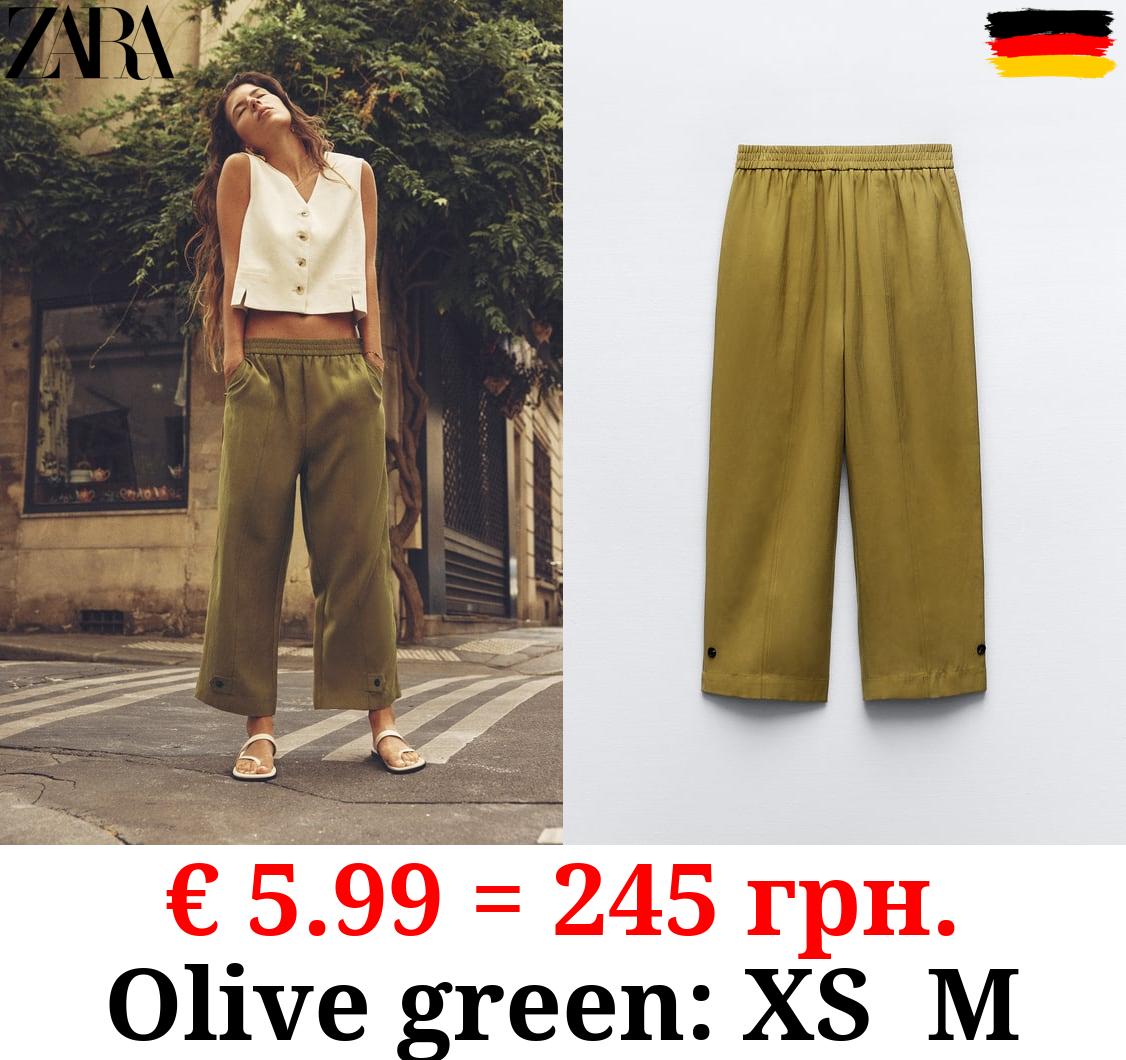 CARROT FIT TROUSERS WITH TABS AT HEM