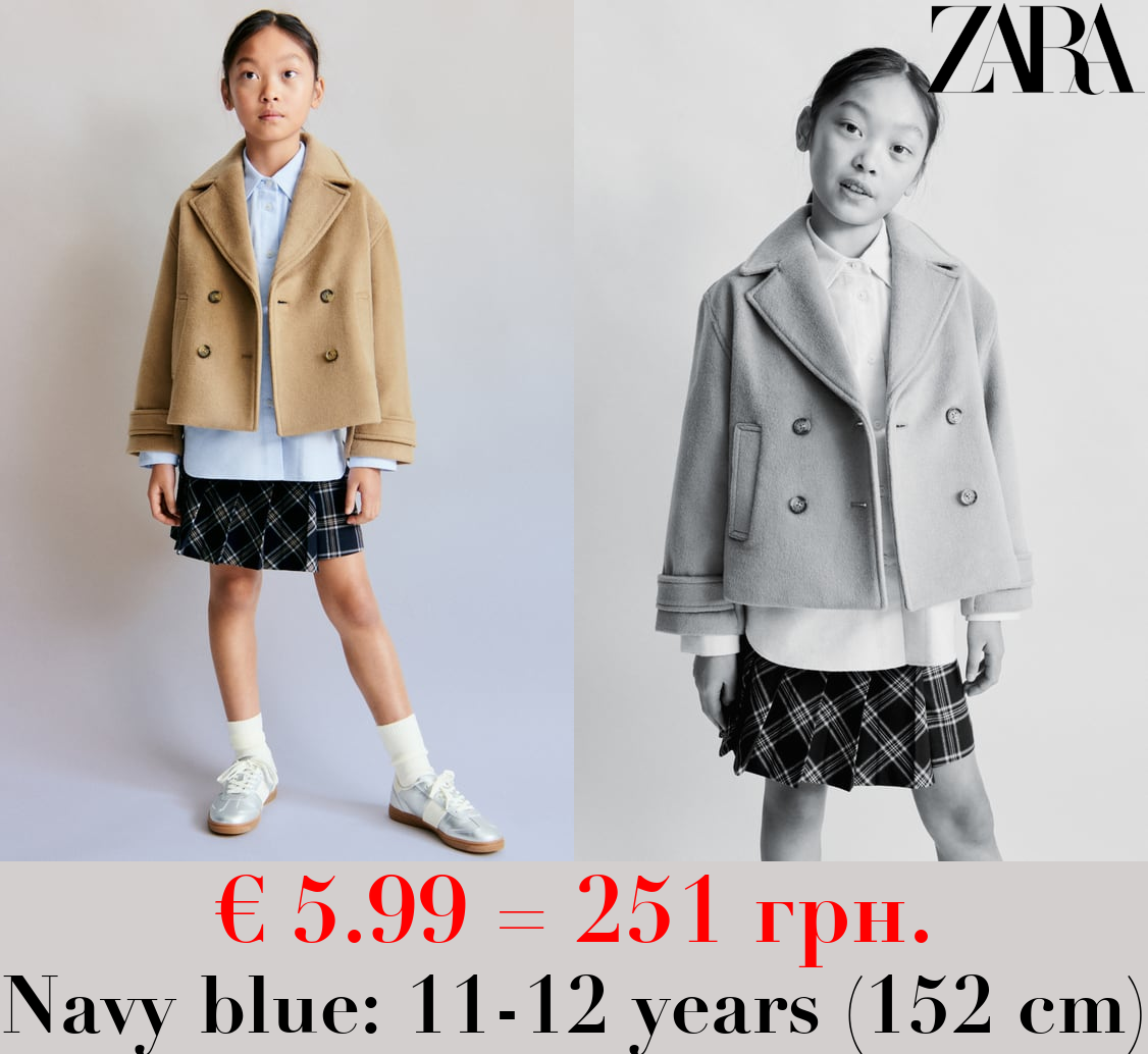 ASYMMETRIC BOX PLEAT SKIRT
