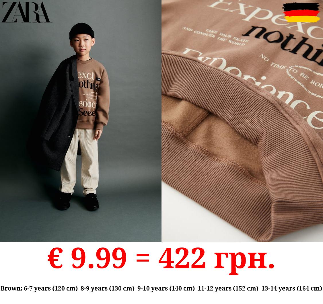 FLOCKED SLOGAN HOODIE