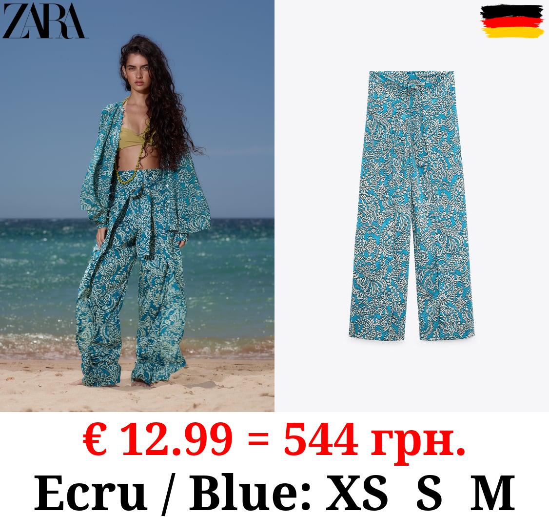 PRINTED WRAP TROUSERS