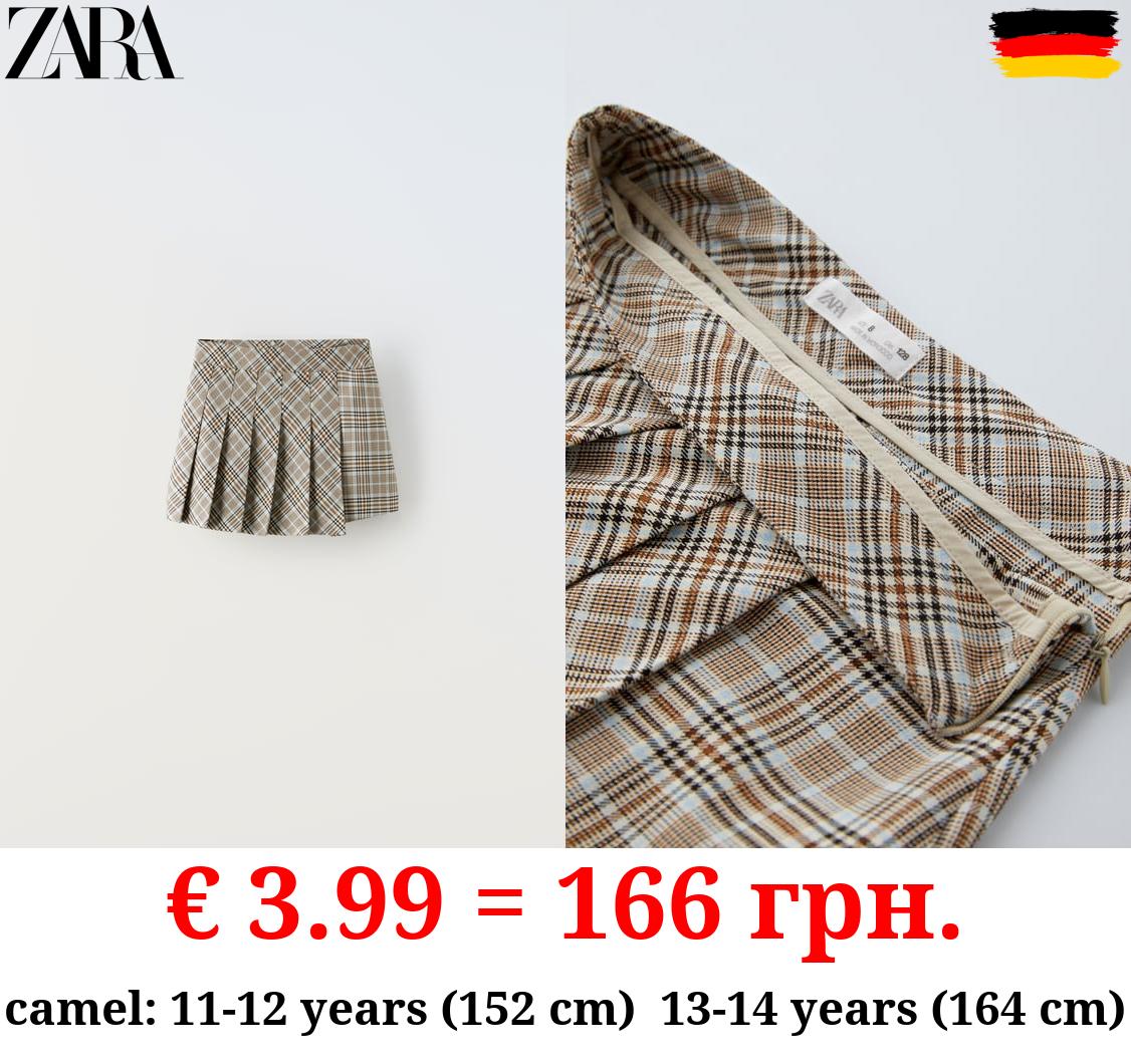 ASYMMETRIC BOX PLEAT SKIRT