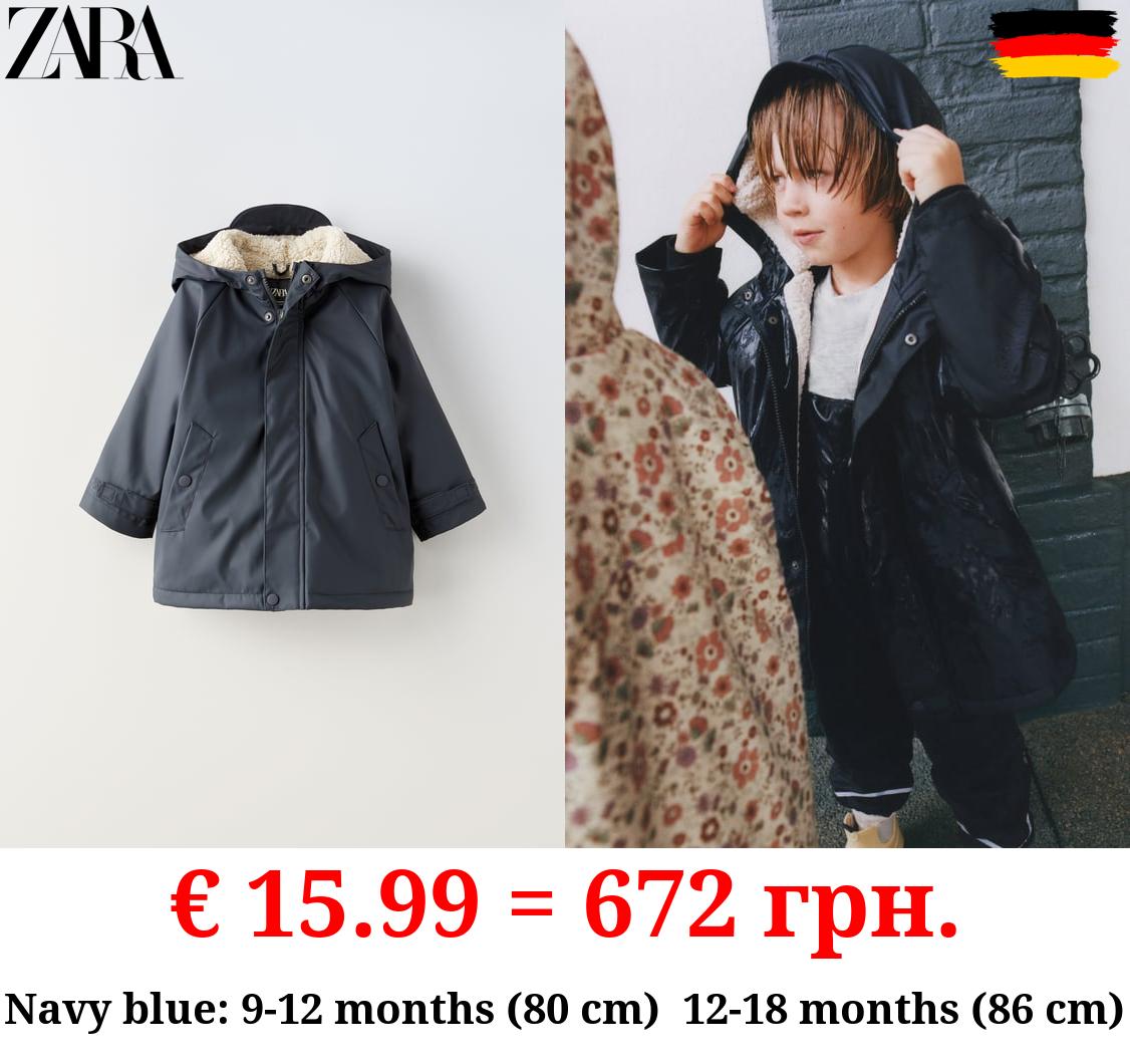 RUBBERISED RAINCOAT WITH FAUX SHEARLING