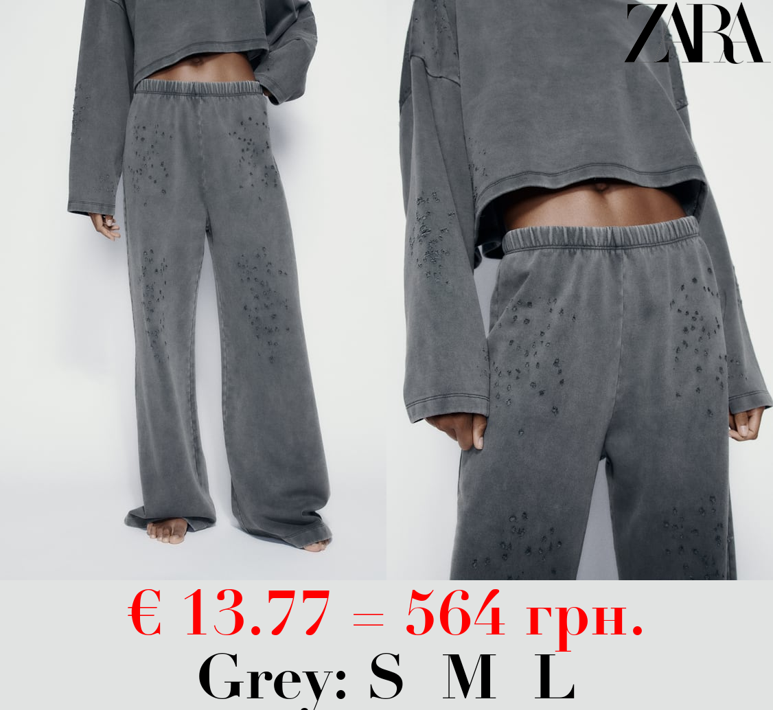 FADED-EFFECT RIPPED PLUSH TROUSERS