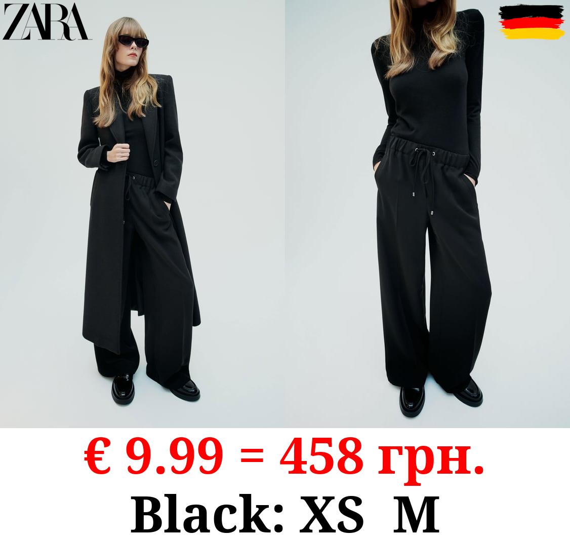 WIDE-LEG TROUSERS WITH ELASTIC WAISTBAND