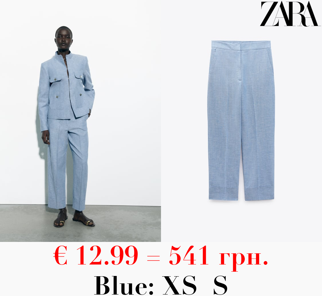 STRAIGHT-LEG TROUSERS WITH TURN-UP HEMS