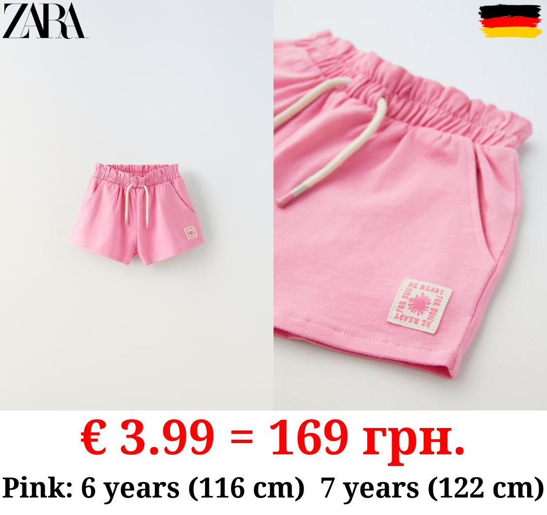 PLUSH BERMUDA SHORTS WITH LABEL DETAIL
