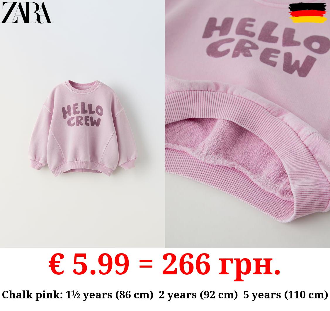SWEATSHIRT WITH PRINTED SLOGAN