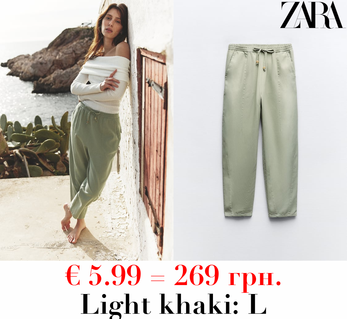 TROUSERS WITH AN ELASTICATED WAISTBAND