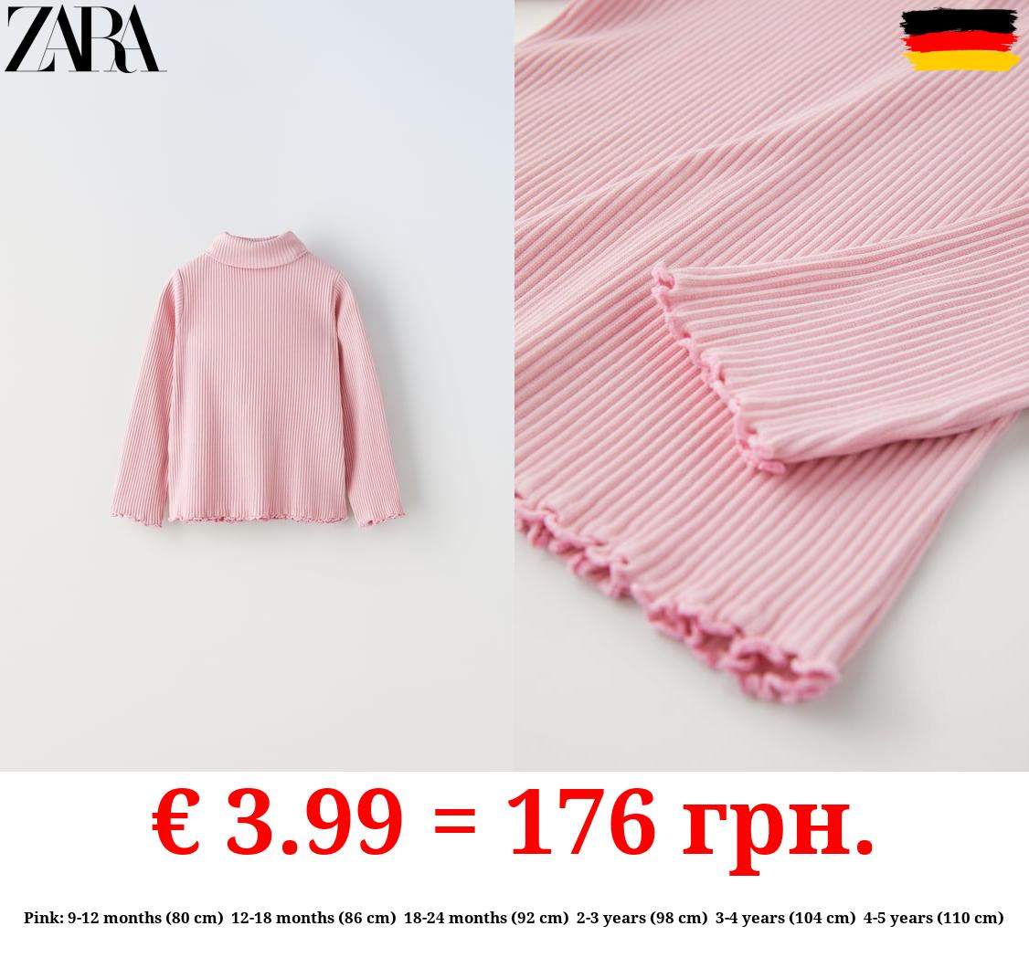 RIBBED TOP WITH SCALLOPED DETAILS