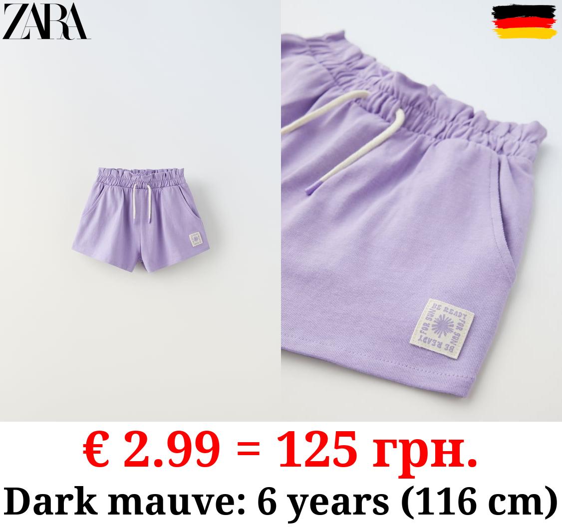 PLUSH BERMUDA SHORTS WITH LABEL DETAIL