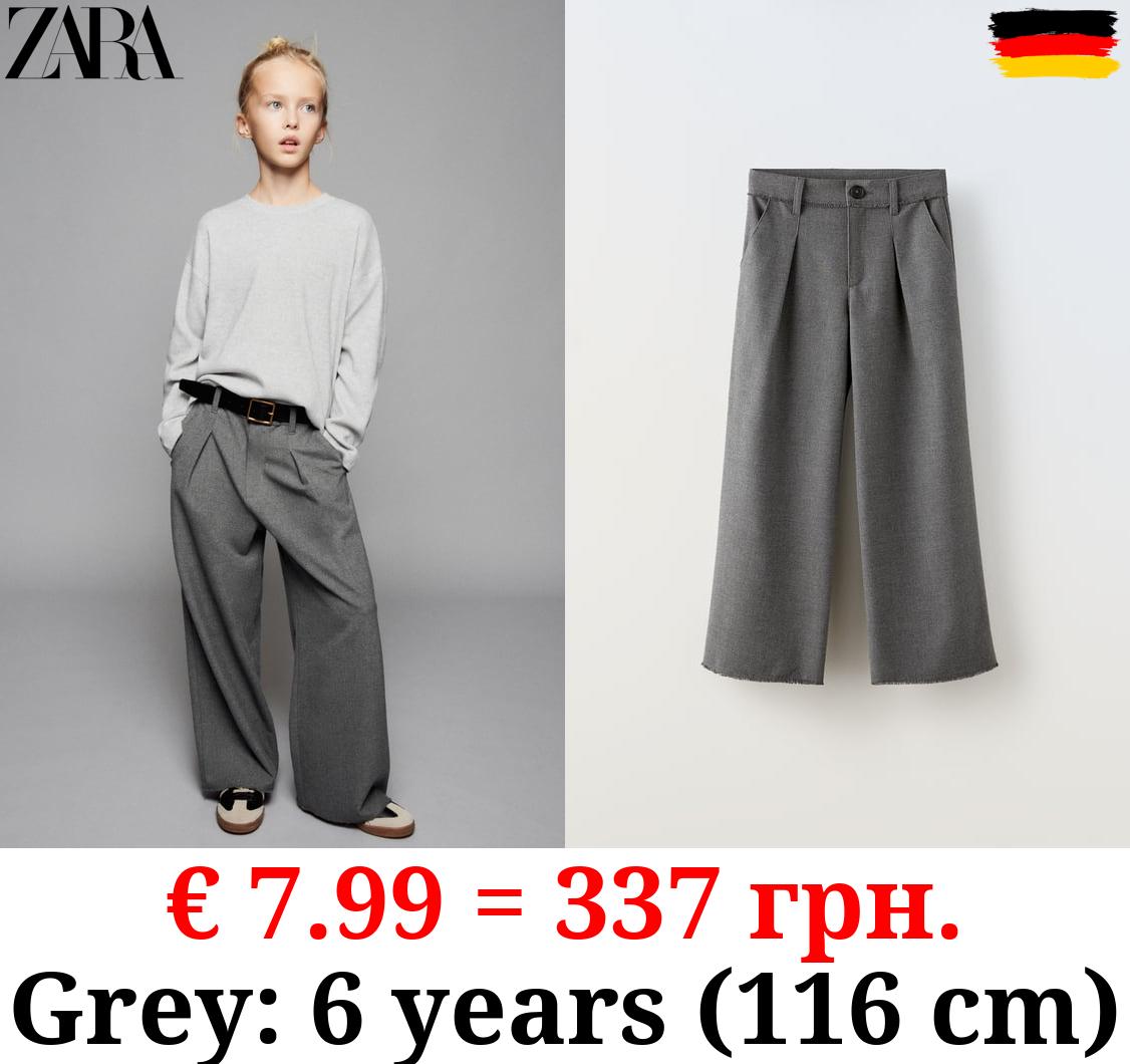 FRAYED PLEATED TROUSERS